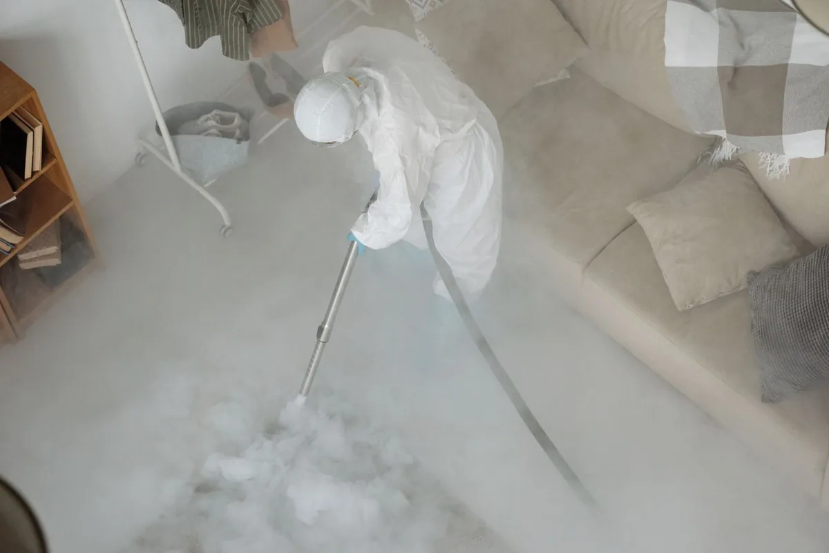 Biohazard cleanup technician in protective equipment, North Granby, CT
